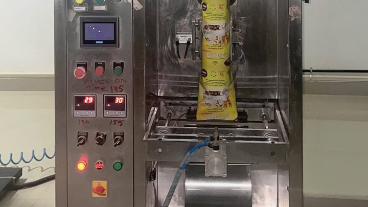]: Amrutham Nutrimix product is filled into packaging in a facility in Kerala, India.