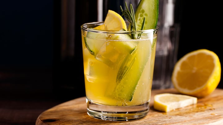 Fresh organic summer cocktail made with kombucha tea with cucumber and lemon.