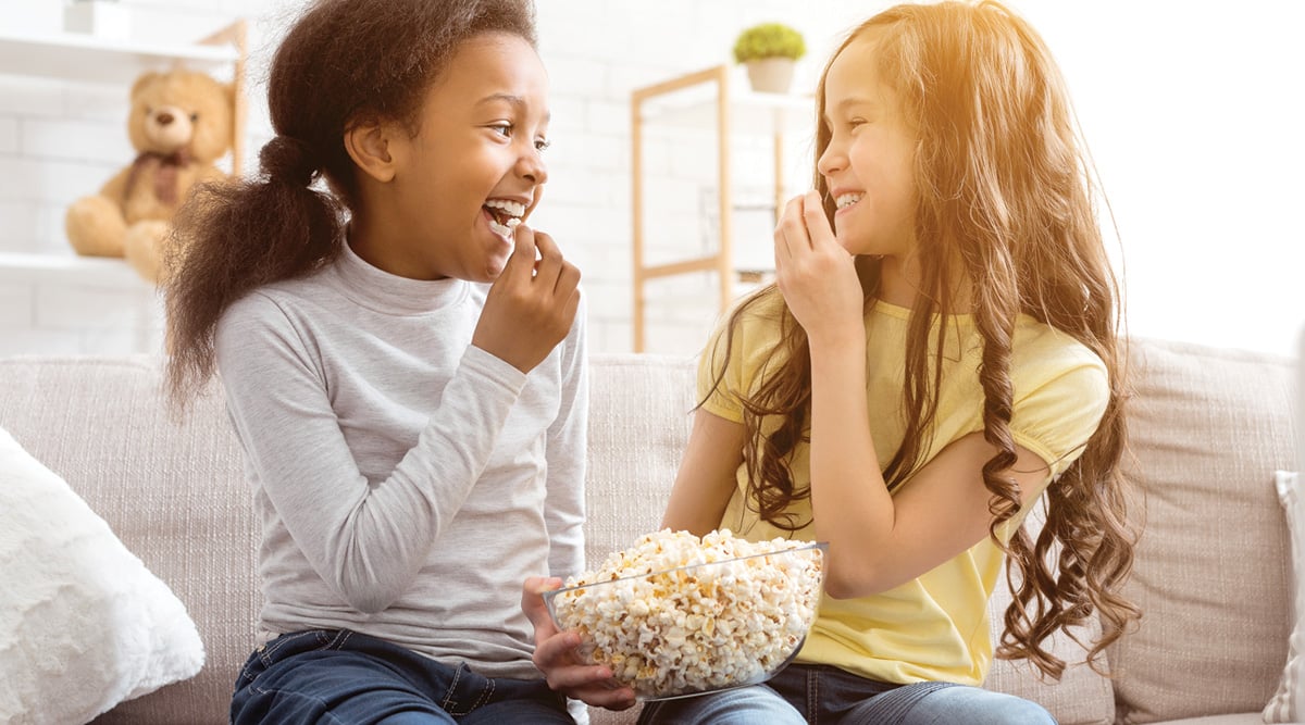 Kids eating popcorn