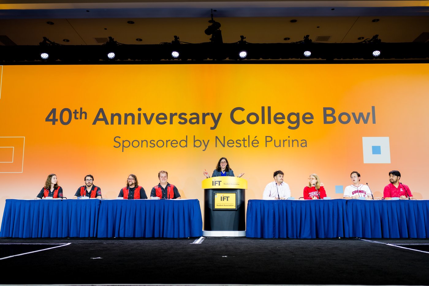 college bowl participants on stage