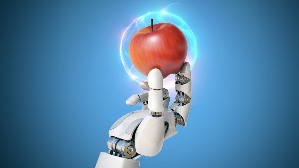 AI arm holding a glowing red apple.