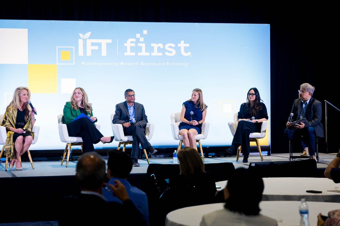 A panel of speakers on stage during an IFT FIRST session.