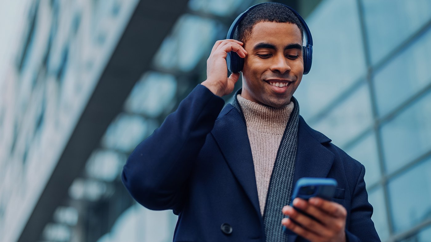 man listening to a podcast