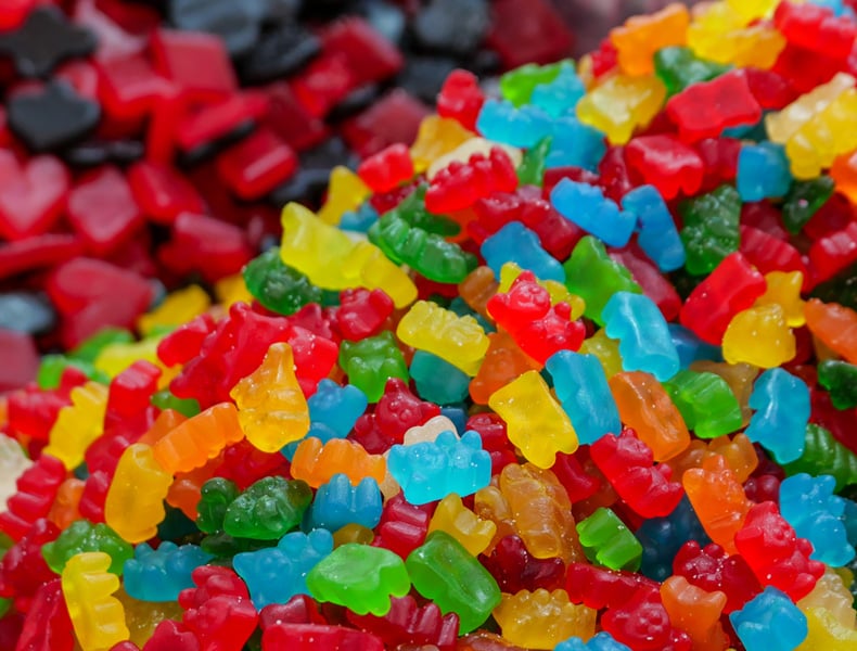 A vibrant pile of colorful gummy bears and candy.