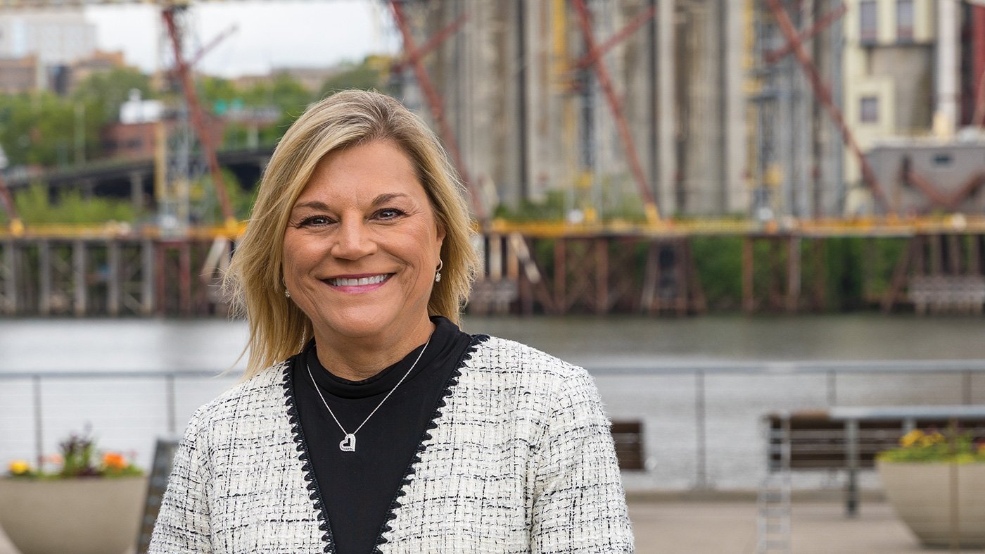 Marcia Walker in front of silo's