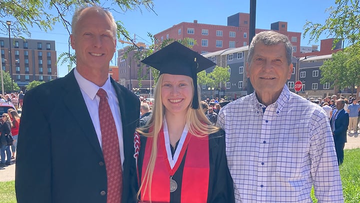 Janine Merkle celebrates her graduation from the University of Nebraska-Lincoln with her father, Jonathan Merkle, (left) and her grandfather, Charles Merkle.