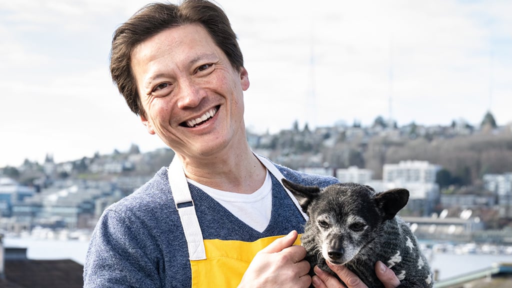 J. Kenji López-Alt poses with his family’s dog, Chen.