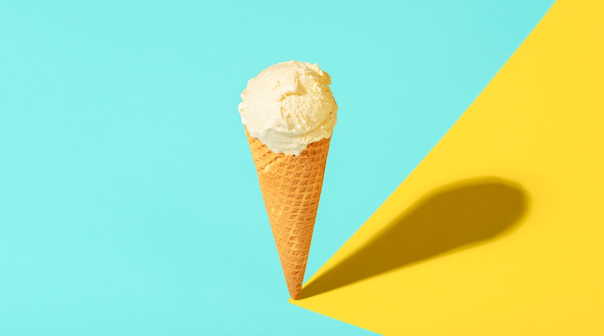 A scoop of ice cream on a sugar cone