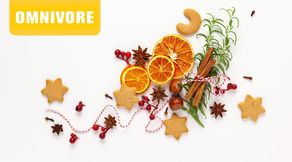 Omnivore Episode 25 holiday cookies, orange slices, cinnamon, chestnuts, red berries, and ribbon