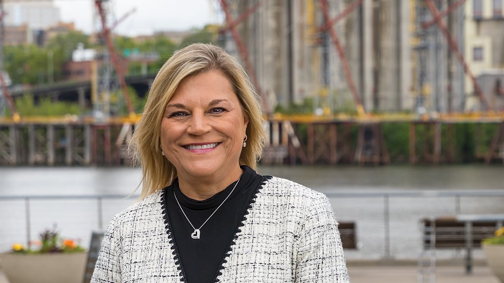 Marcia Walker in front of silo's