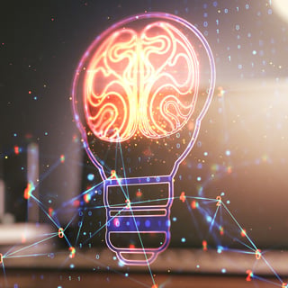 Creative light bulb with human brain hologram on modern laptop background, artificial Intelligence and neural networks concept. Multiexposure.