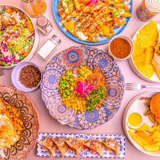 Colorful food recipe dish set, with casseroles, appetizers, gyozas, burgers with potatoes and spices.