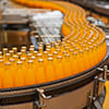 Orange soda bottles on conveyor belt