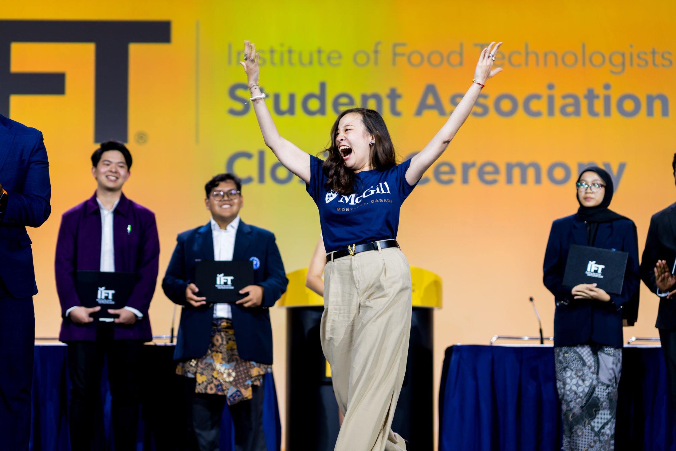 Student happy on stage during IFTSA Closing Ceremony at IFT FIRST.