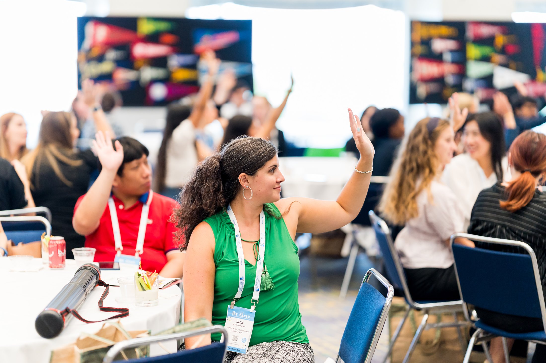 students raising hands