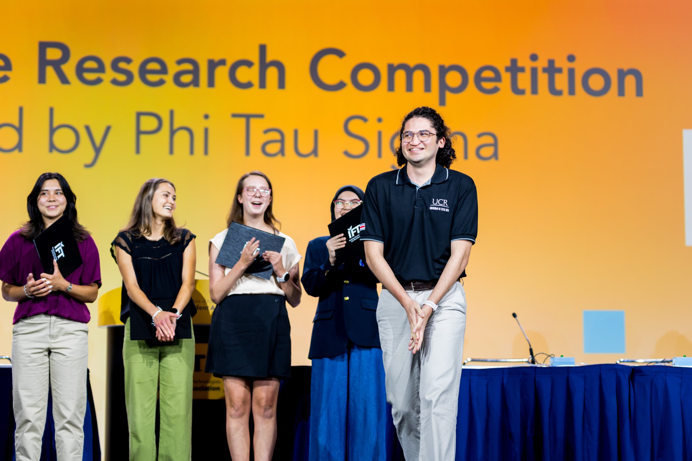 research competition winner on stage