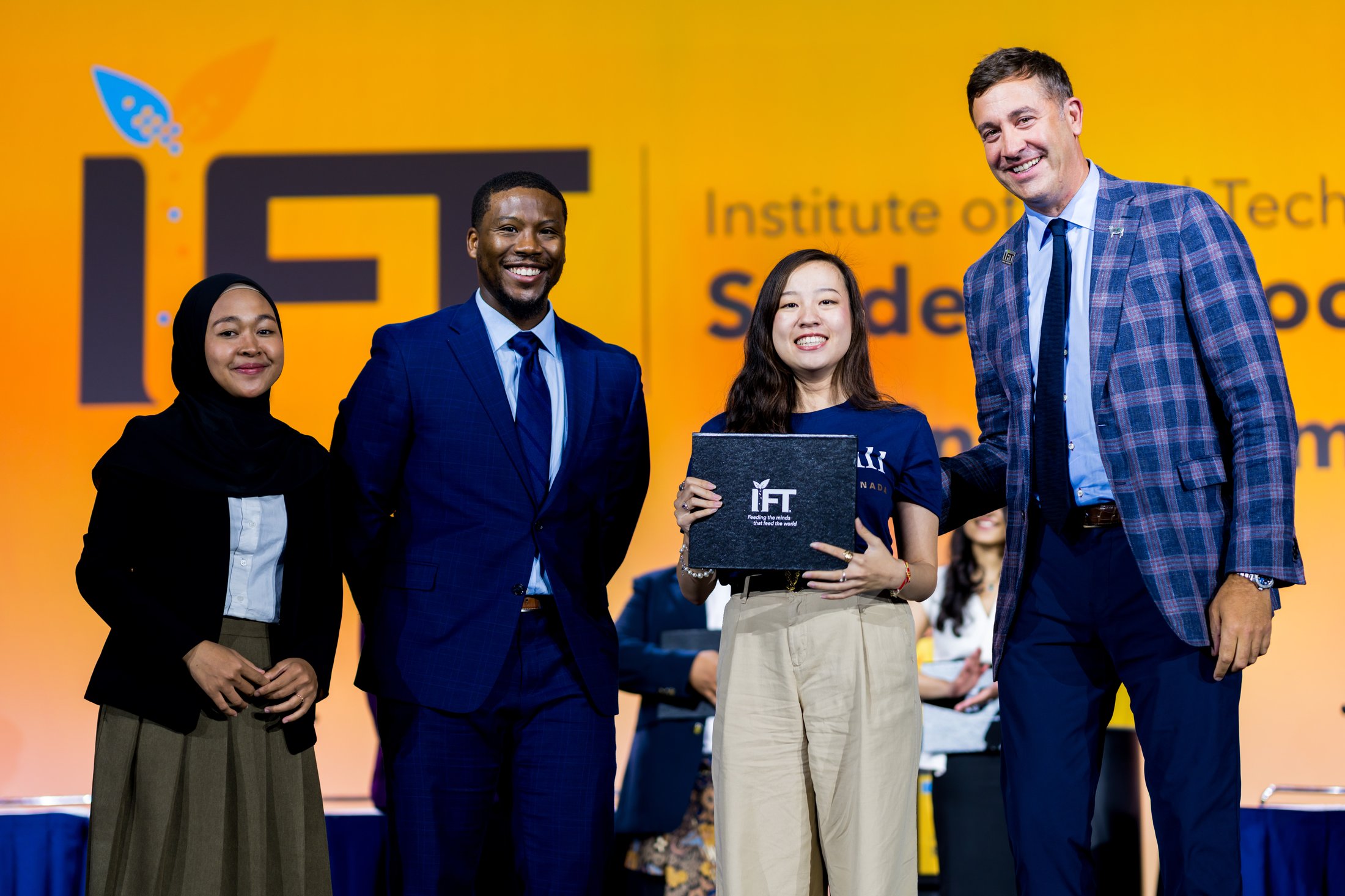 team finalists and sponsors on stage