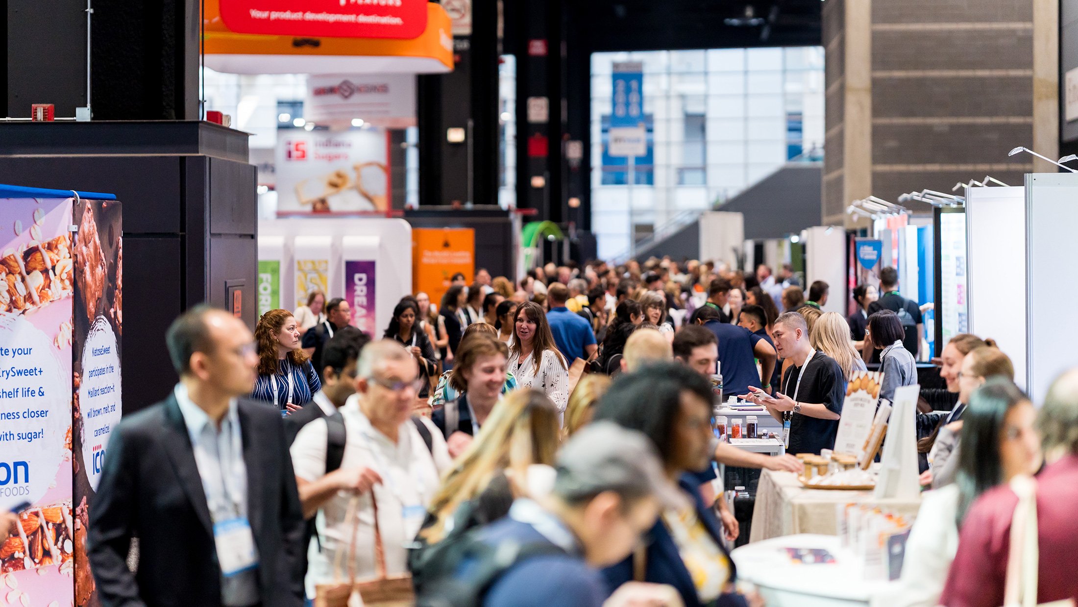 A busy expo hall of exhibitor booths and attendees at IFT FIRST in McCormick Place, Chicago, IL