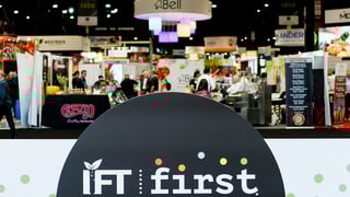 IFT FIRST expo hall entrance with signage and exhibitor booths at McCormick Place in Chicago, IL