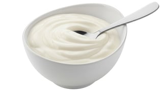 Isolated Bowl of Yogurt with Spoon.