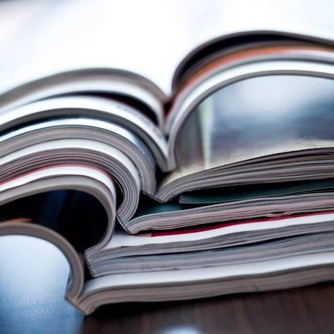 Magazine flipped open and stacked