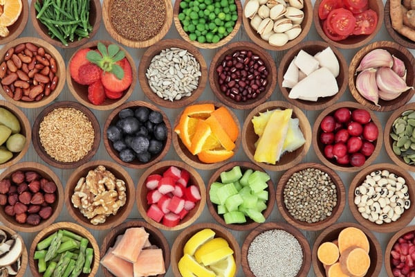 Mix bowls of grain, fruit, and vegetables
