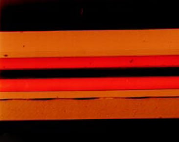 Fig. 1—Cross-section of a 7-layer barrier material photographed using 200× magnification