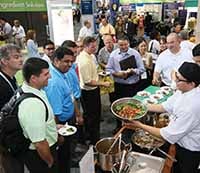 Sampling products at teh Food Expo