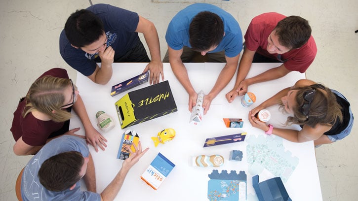Six people sitting around a table