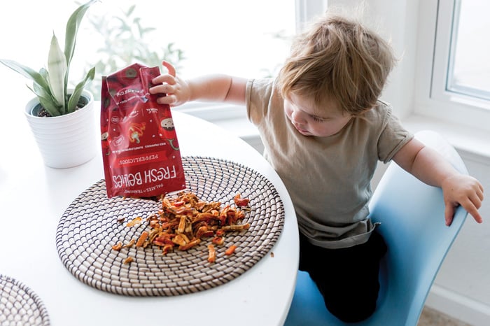 Toddler pouring out package