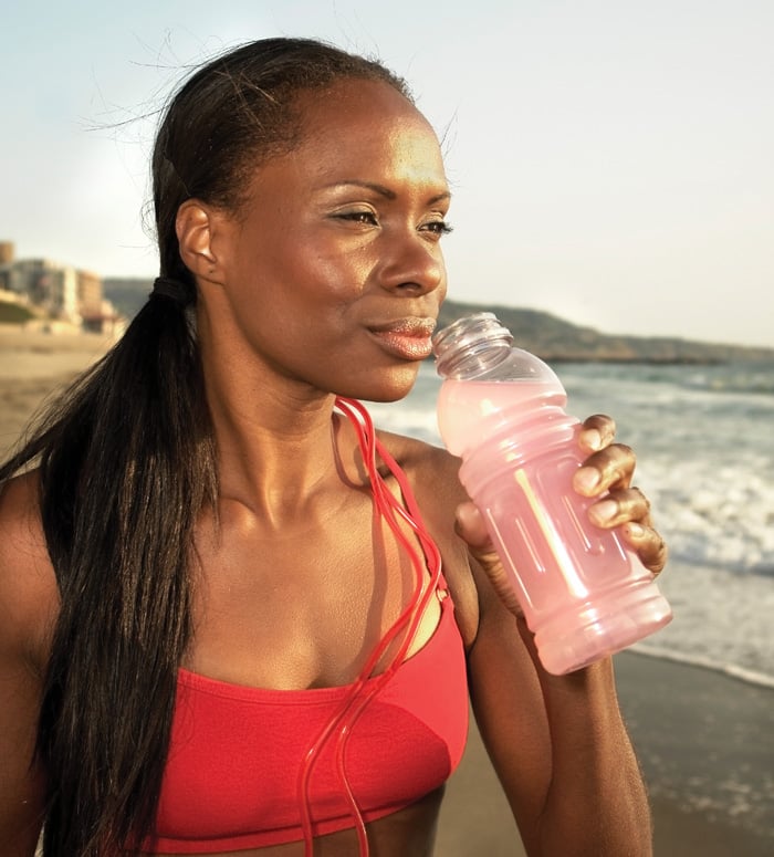 Female athlete drinking 