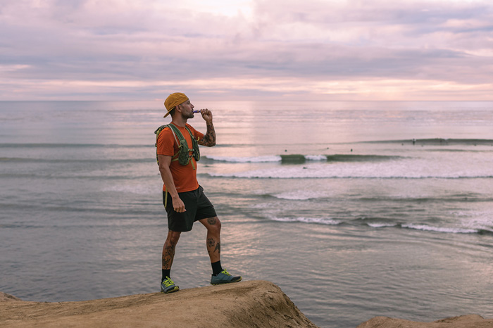 man standing by lake