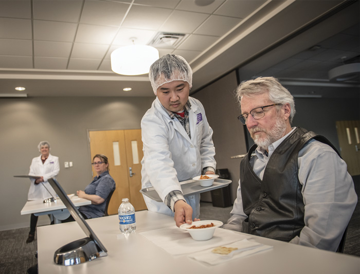 Sensory PhD student Gongshun Yang assists during package and product testing protocols