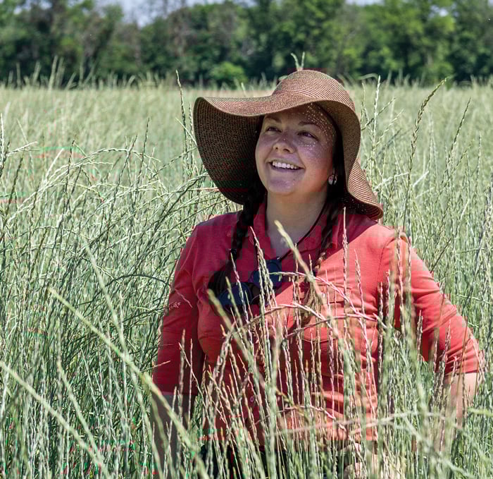 Tessa Peters in a kernza field.