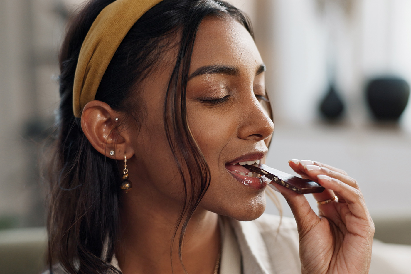 Woman eating chocolate.