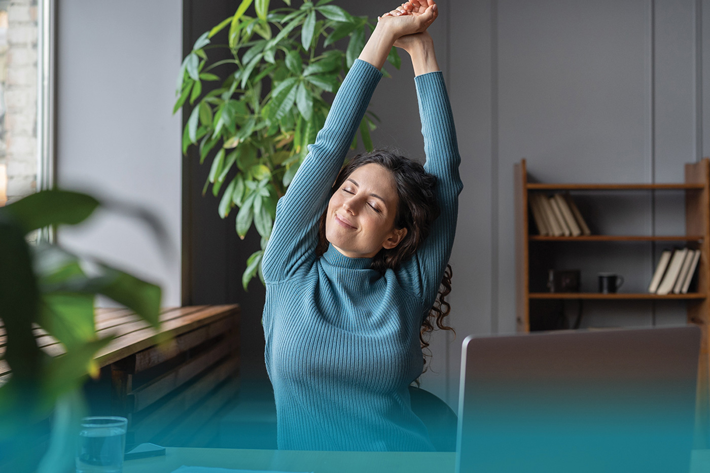 Woman stretching at her desk