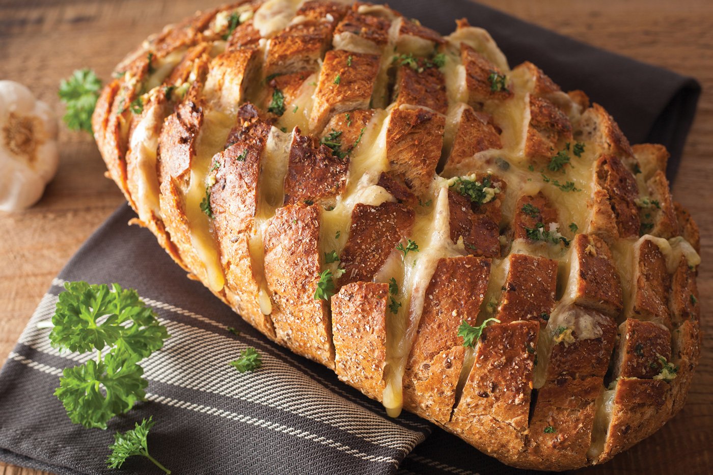 aked party bread with melted cheese butter herbs