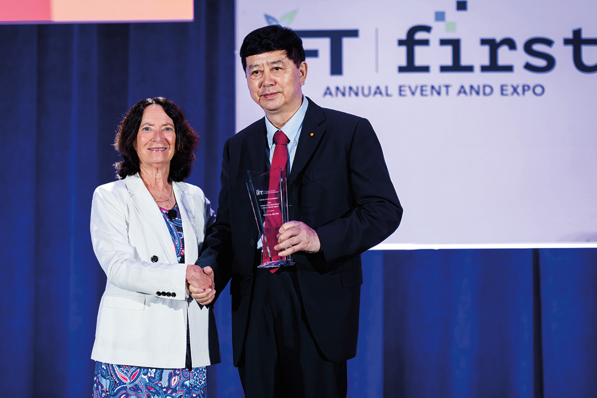 Rui Hai Liu, MD, PhD, receiving IFT's highest honor, the Lifetime Achievement Award in honor of Nicolas Appert, at IFT FIRST.