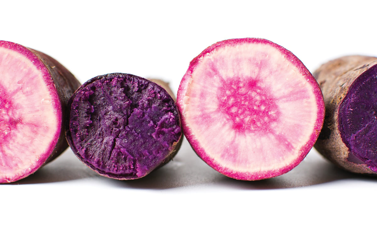 Raw and cooked purple potatoes