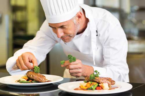 Chef plating food