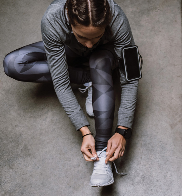woman tying shoes