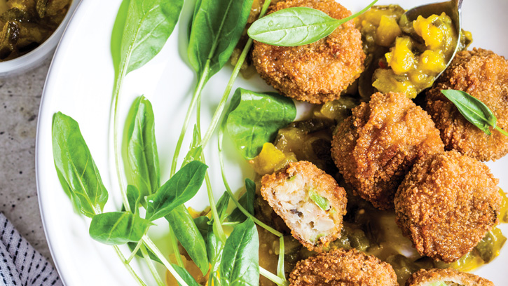 Vegan vegetable meatballs with spinach and green dressing