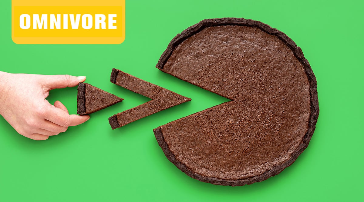 Omnivore logo. Chocolate care with triangular slices taken out of it and a hand grabbing a piece.